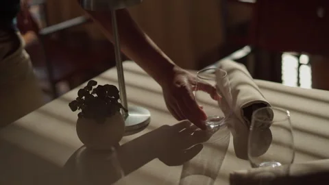 Waitress Puts Glass On Table In Restaurant. She Serves Table. Stock Footage 275596491