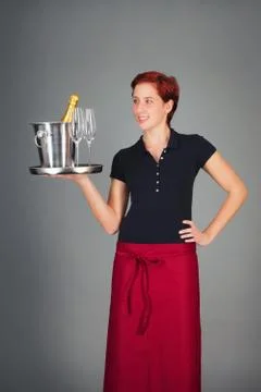 Waitress serving champagne Stock Photos