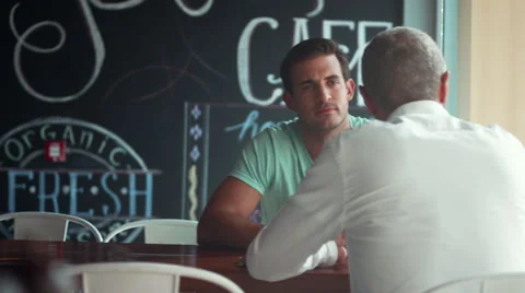 Waitress serving coffee to customer at cafe. Stock Footage 64094133