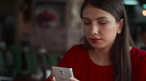 Waitress serving coffee to customer messaging on mobile. Stock Footage 64093960
