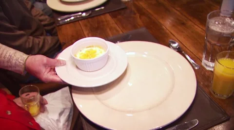 Waitress serving dessert to customer in ranch cabin Stock Footage 54593584