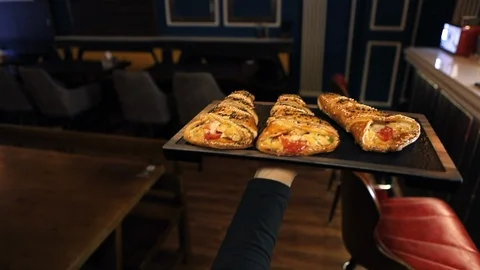 The Waitress serving a dinner in restaurant. Slow Motion Stock Footage 119001511