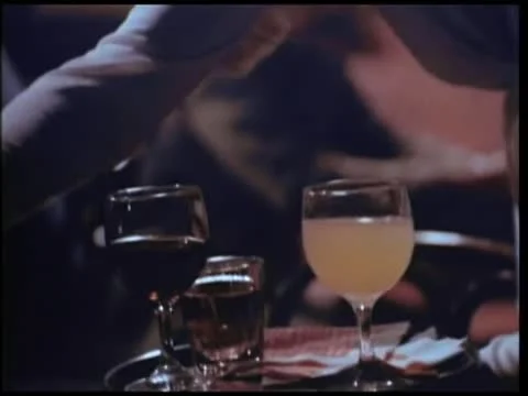 Waitress serving drinks to customers at table Stock Footage 25207482