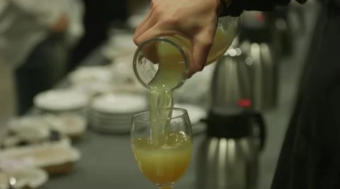 Waitress serving fruit juice at an event Stock Footage 64566253