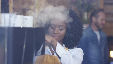 Waitress smiling at camera while preparing coffee at cafe Stock Footage 108013654