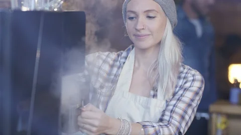 Waitress smiling at camera while preparing coffee at cafe Stock Footage 108014008