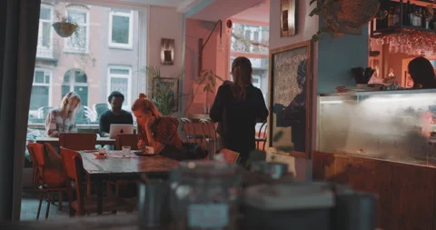Waitress taking coffee from the counter and delivers Stock Footage 203582082