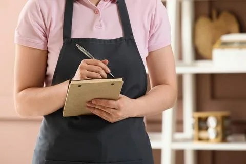 Waitress taking order with notepad in restaurant 스톡 사진