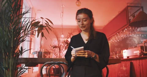 Waitress taking an order, writing down Stock Footage 203581465