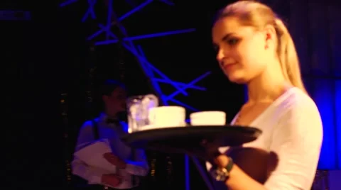 Waitress with a tray and cups at the disco Stock Footage 44732600