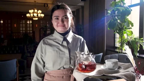 Waitress with tray standing in cafe Stock Footage 152755788