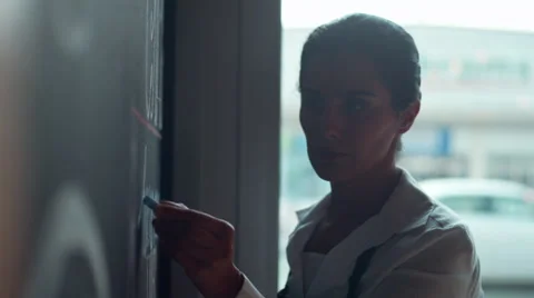 Waitress writing on blackboard menu in cafe. Stock Footage 64099139