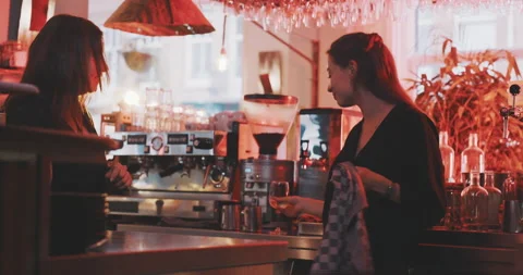 Waitresses having afterhours drink and chatting Stock Footage 203583785