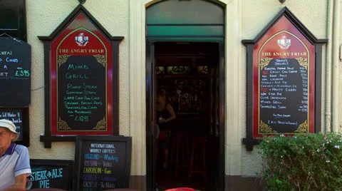 Waitresses at a  pub in Gibraltar Stock-Footage 25395785