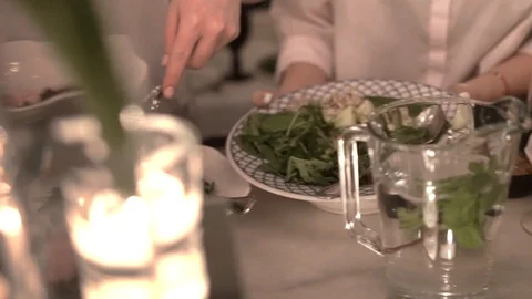 Waitresses remove a glassware with food from table after dinner in fancy bistro 스톡 동영상 117377544