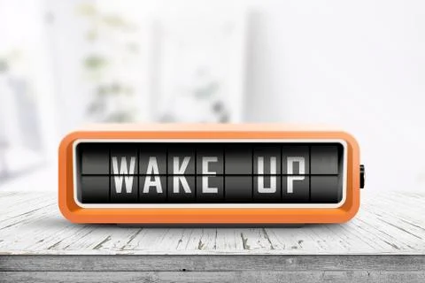 Wake up alarm clock on a table in a bright room Stock Photos
