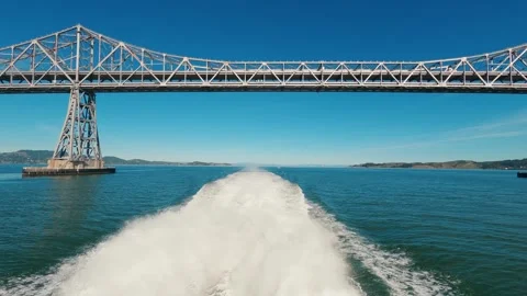 Wake behind power boat under Richmond bridge Stock Footage 260572968