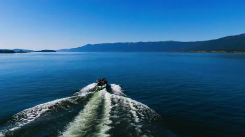 Wake Boarder- Playing in wake Stock Footage 141080202