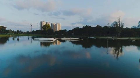 Wake boarder Surfing On The River or Lake. Aerial Video. Ski Surfing Skier Jet Stock Footage 90014022