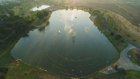 Wake boarder Surfing On The River or Lake. Aerial Video. Ski Surfing Skier Jet Stock Footage 90014432