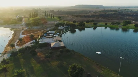 Wake boarder Surfing On The River or Lake. Aerial Video. Ski Surfing Skier Jet Stock Footage 90014529