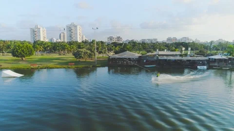 Wake boarder Surfing On The River or Lake. Aerial Video. Ski Surfing Skier Jet Stock Footage 90014714