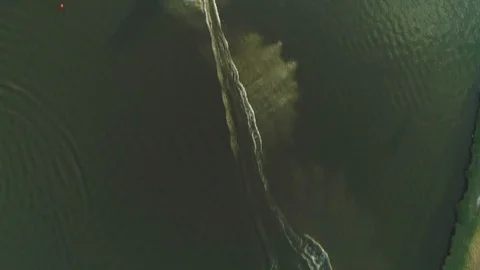 Wake boarder Surfing On The River or Lake. Aerial Video. Ski Surfing Skier Jet Stock Footage 90015214