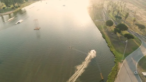 Wake boarder Surfing On The River or Lake. Aerial Video. Ski Surfing Skier Jet Stock Footage 90015765