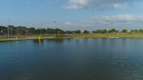 Wake boarder Surfing On The River or Lake. Aerial Video. Ski Surfing Skier Jet Stock Footage 90016065