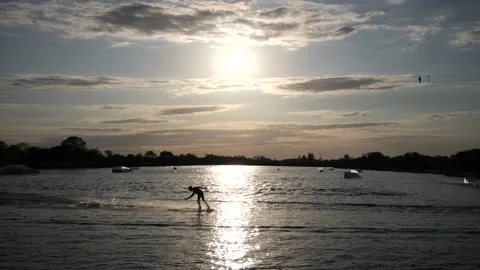 Wake Boarder Waterskiing Setting Sun Stock Footage 200849291