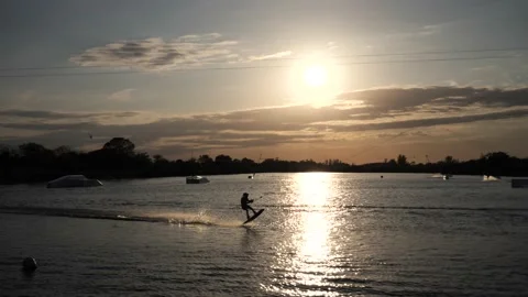 Wake Boarder Waterskiing Setting Sun Stock Footage 200849295
