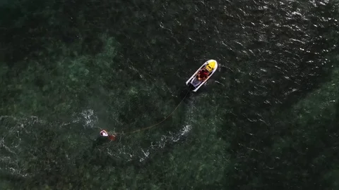 Wake Boarder On Wave Runner Ocean Reef Drone Shot 4K Stock Footage 114837587