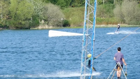 Wake boarding over a jump in slow motion Stock Footage 106990185