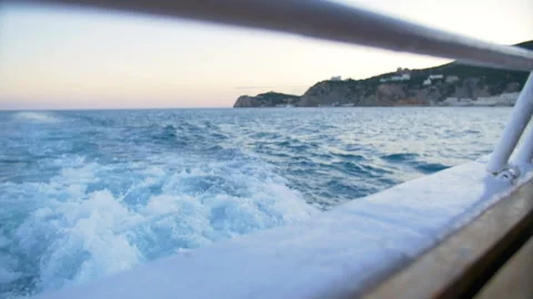 The wake of a boat as seen from the side of a ship. Video stock 89833999