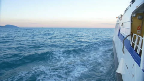 The wake of a boat as seen from the side of a ship. Stock Footage 89834153