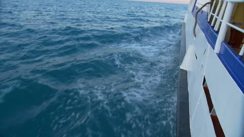 The wake of a boat as seen from the side of a ship. Stock Footage 89834228