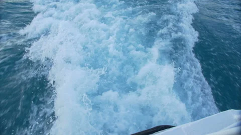 The wake of a boat as seen from the side of a ship. Stock Footage 89834379