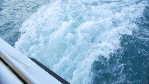 The wake of a boat as seen from the side of a ship. Stock Footage 89834741