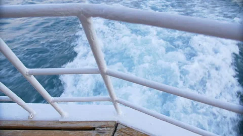 The wake of a boat as seen from the side of a ship. Stock Footage 89852663