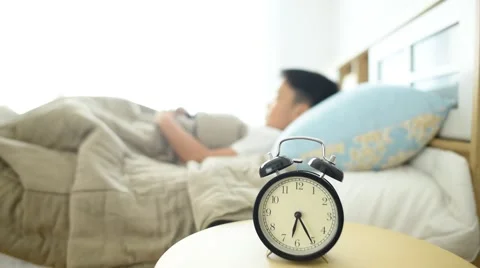 Wake up boy with alarm clock 库存影片 61372917