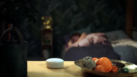Wake Up call by an Alexa Dot Stock Footage 132909737
