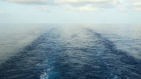 Wake of the cargo ship on water surface. Stock Footage 77369649