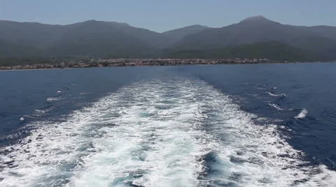 Wake of cruise ship with view of distant coastline Stock Footage 65087985