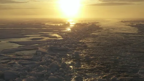 Wake of ship in sun rays. Trace from icebreaker with ice. Drifting ice on sunny Stock Footage 271176473