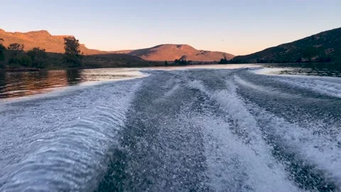 Wake as speedboat accelerates at sunset Stock Footage 189985521