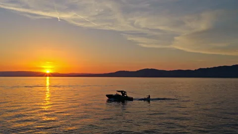 Wake Surfer at Sunset on Lake Geneva Switzerland Stock Footage 337946119