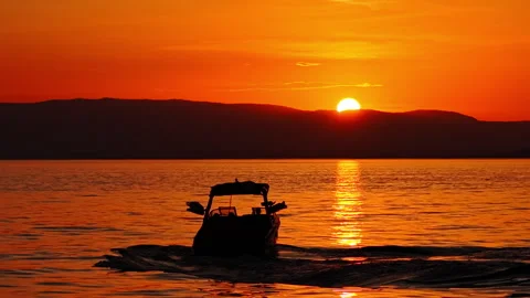 Wake Surfer at Sunset on Lake Geneva Switzerland Stock Footage 337946404