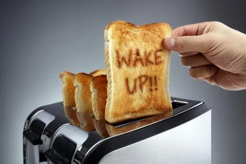 Wake up toasted bread in a toaster Stock Photos