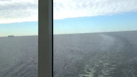 Wake trail in the ship window Stock Footage 95432383