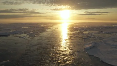 Wake of vessel in rays of sun. Trace from ship with ice. Arctic landscape. Back Stock Footage 266242506